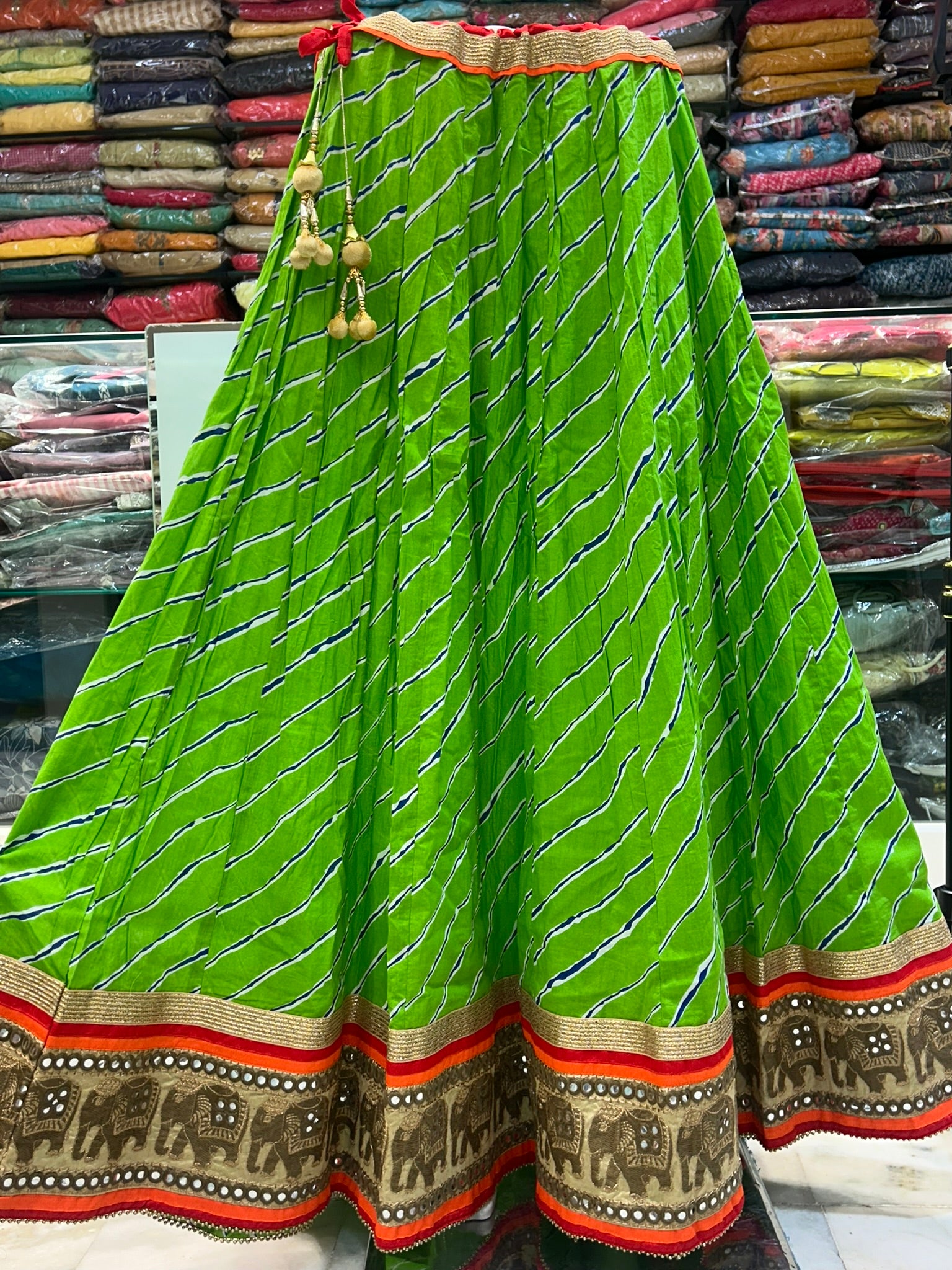 long green printed traditional skirt with emblished border lace