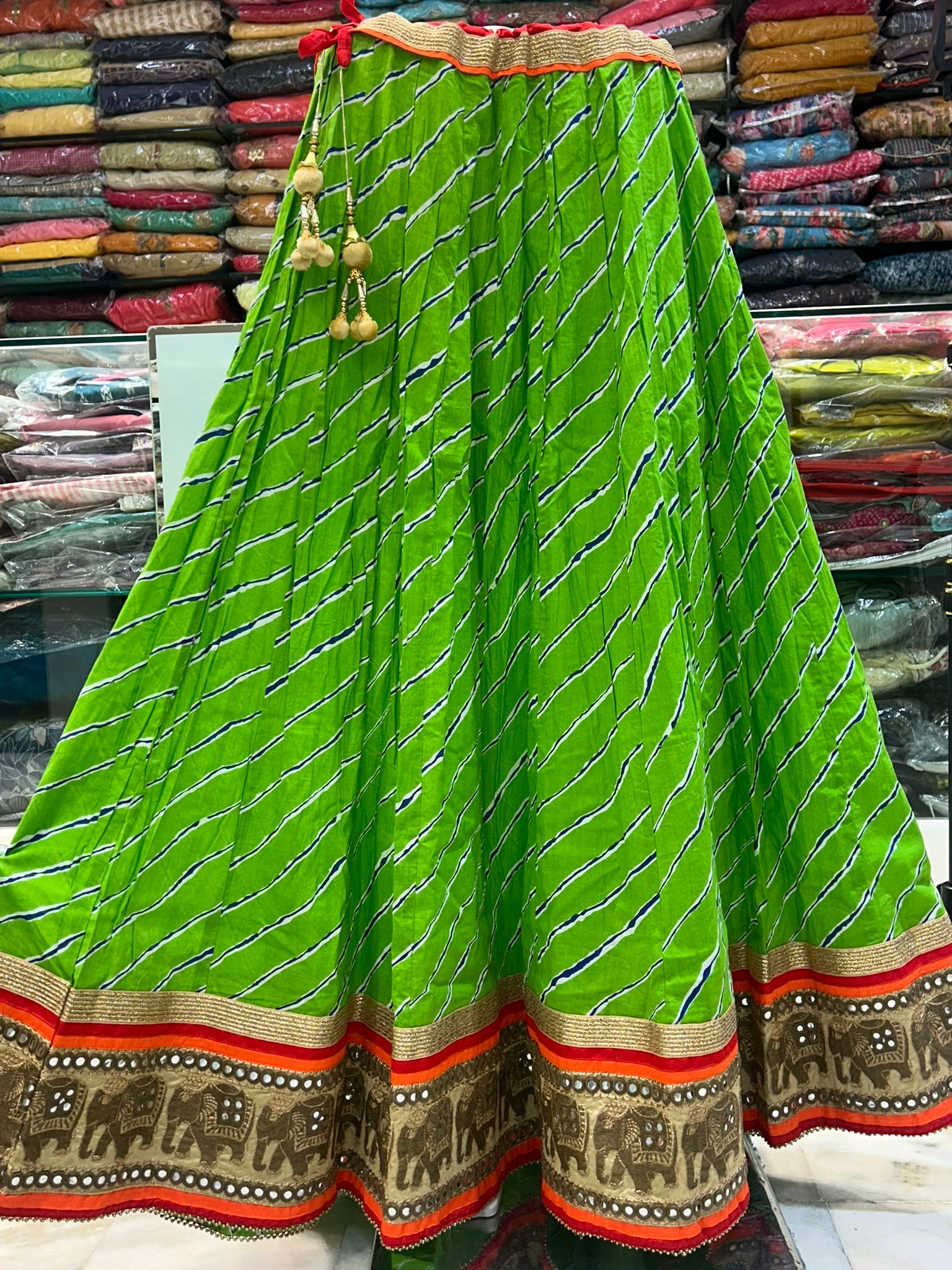 long green printed traditional skirt with emblished border lace