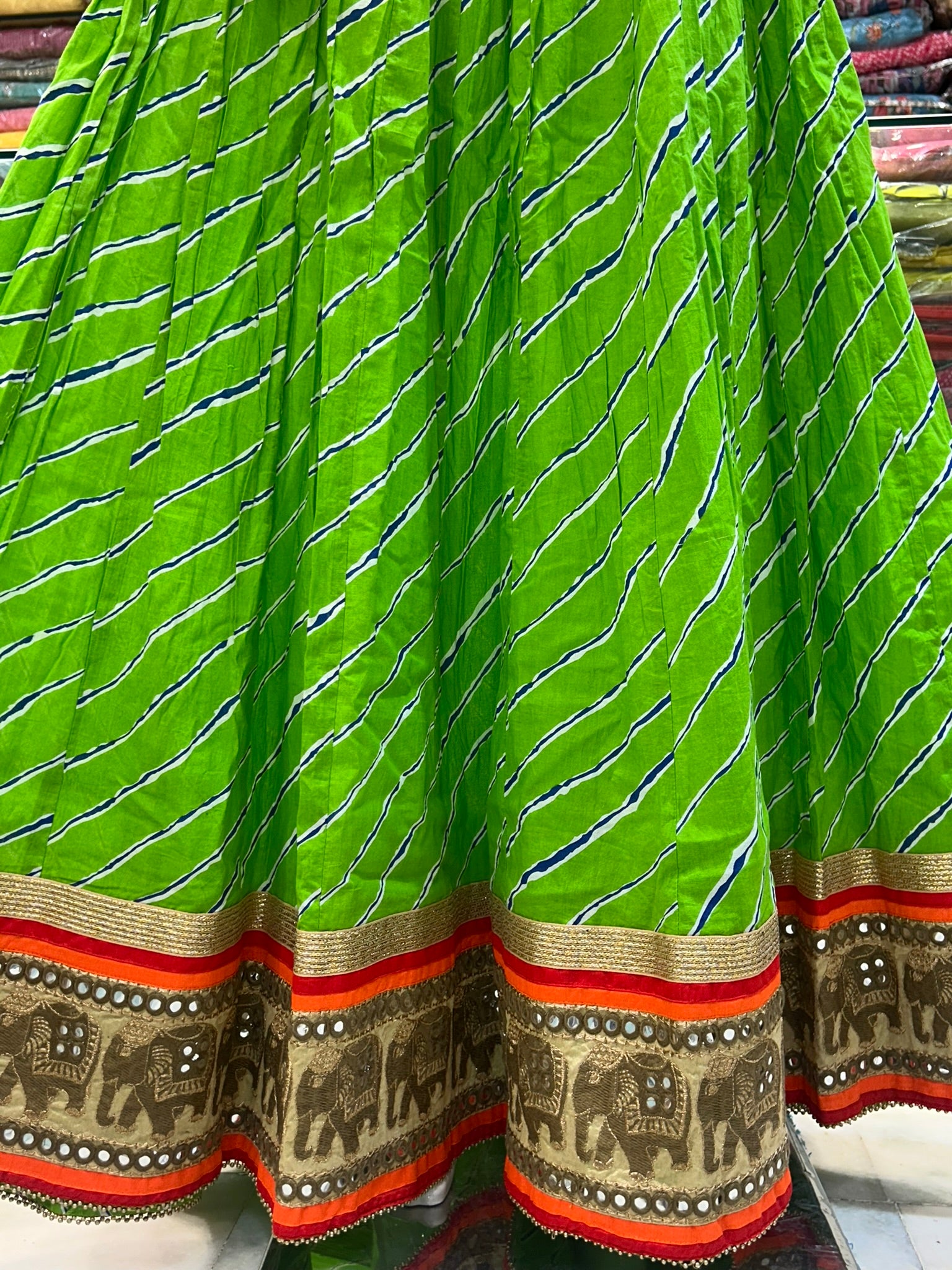 long green printed traditional skirt with emblished border lace
