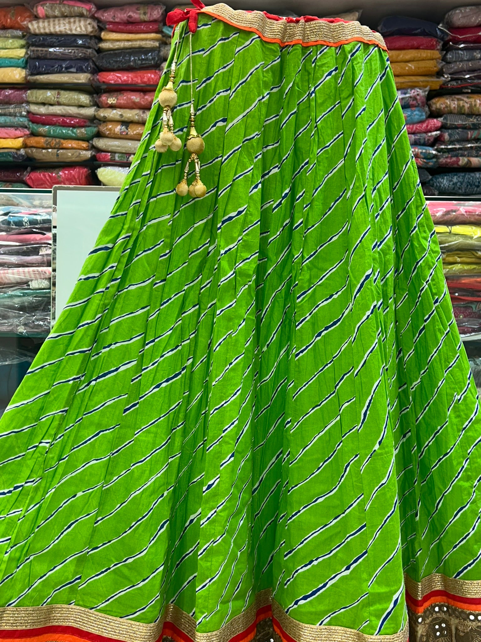 long green printed traditional skirt with emblished border lace