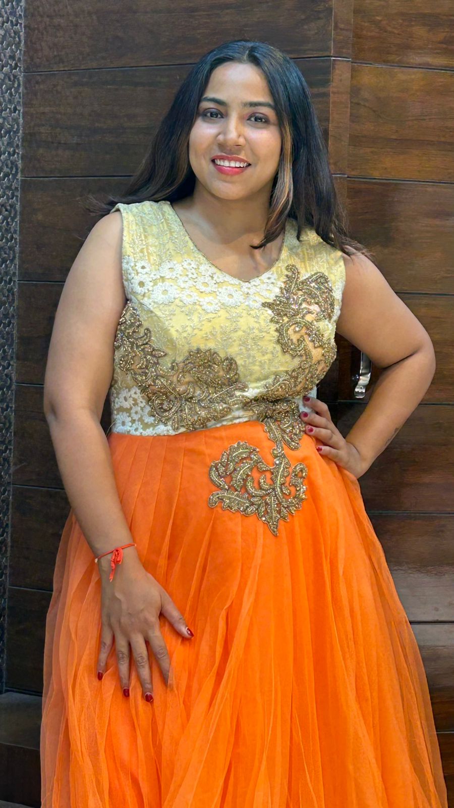 classy look orange net partywear gown