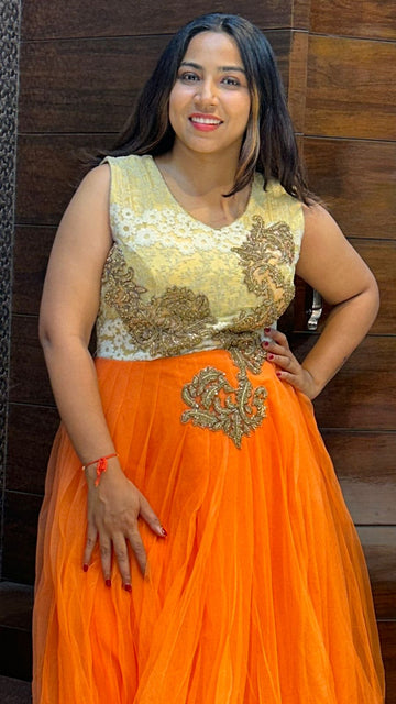 classy look orange net partywear gown